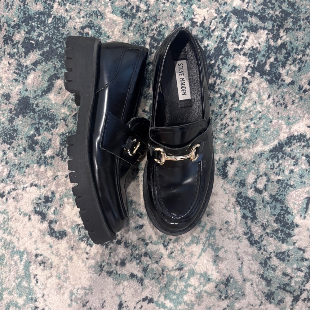 Steve Madden “Lando” Glossy Black Leather Loafers with Gold Accent